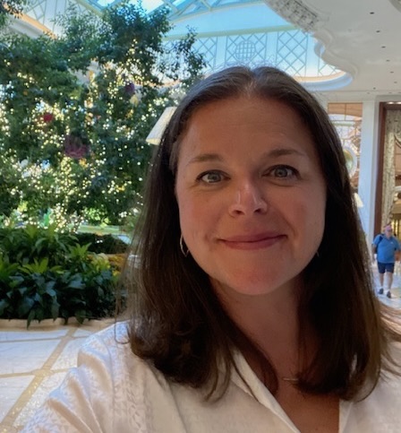 Photo of Julie in an atrium